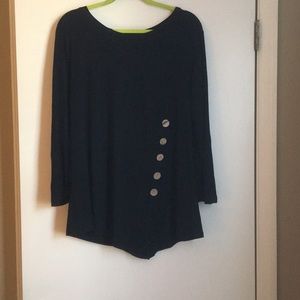 Black long sleeve top with button accents.